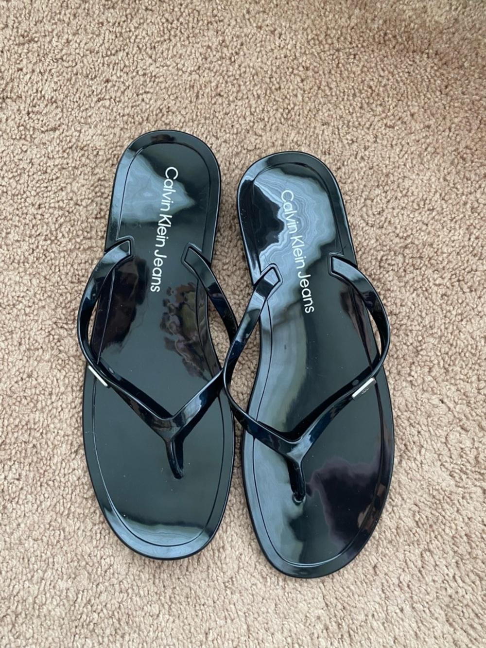 Calvin Klein Jeans Women’s Glossy Black Jelly Flip Sandals
